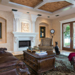 The Indialantic Estate Living Room with a stone fireplace