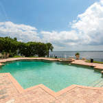 The Indialantic Estate home's pool & patio with river views