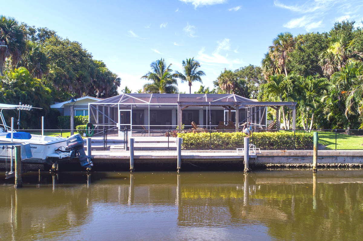 View from the navigable canal of this nice home for sale in Vero Beach 