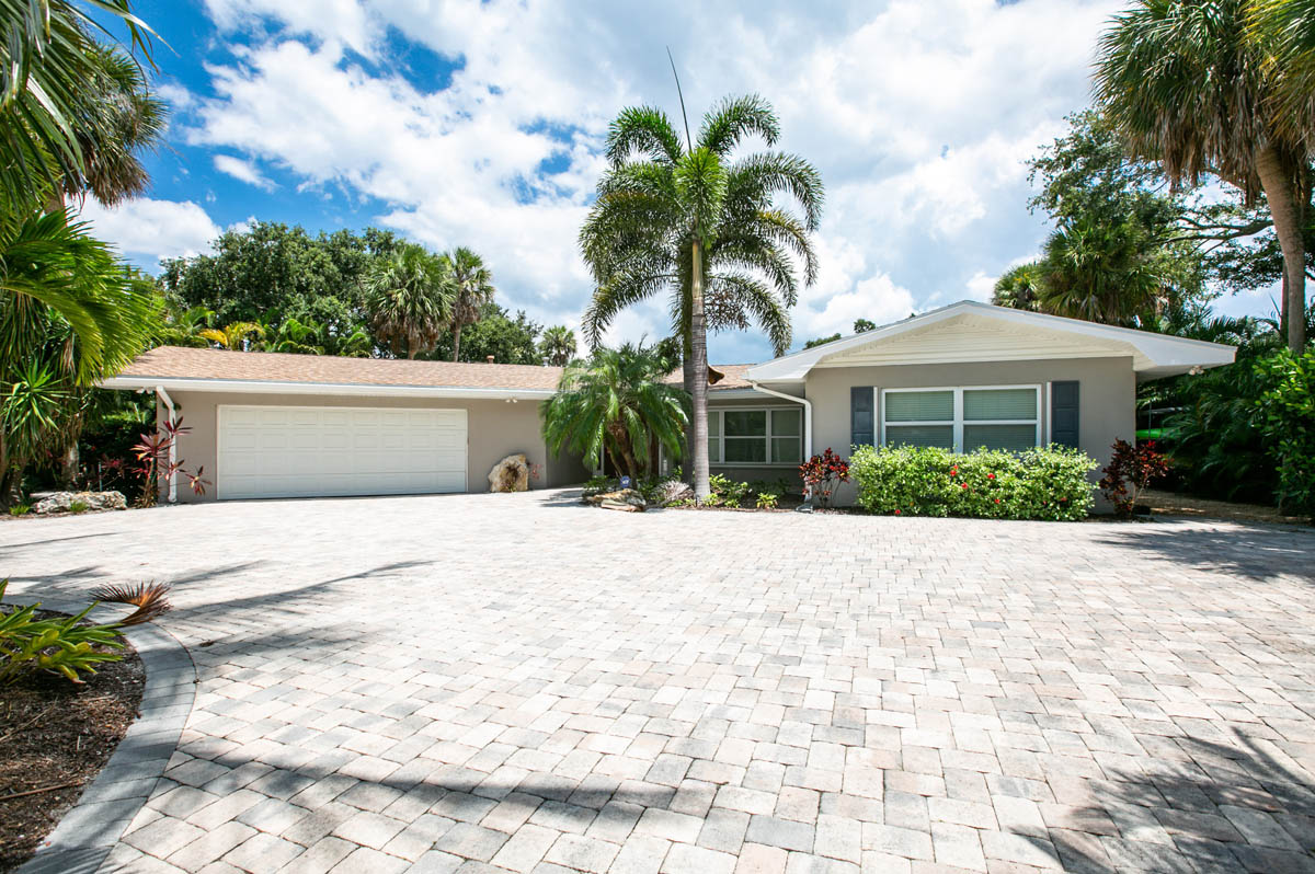 The exterior front & circular driveway of this nice Vero Beach home