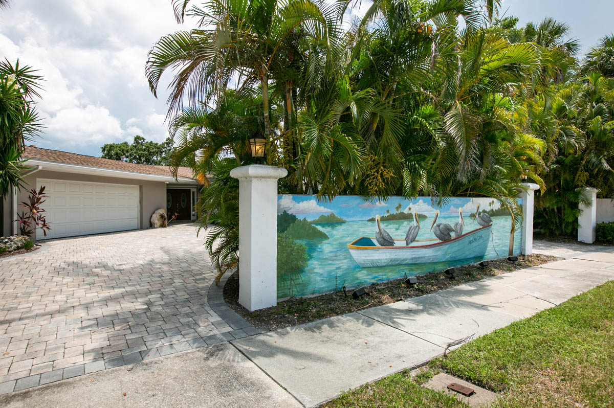 A custom mural adorns the exterior wall as seeing from the road.