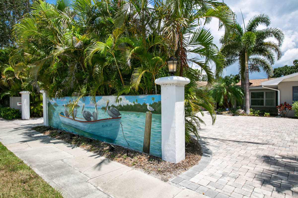 Another view of the exterior wall with the custom mural and driveway