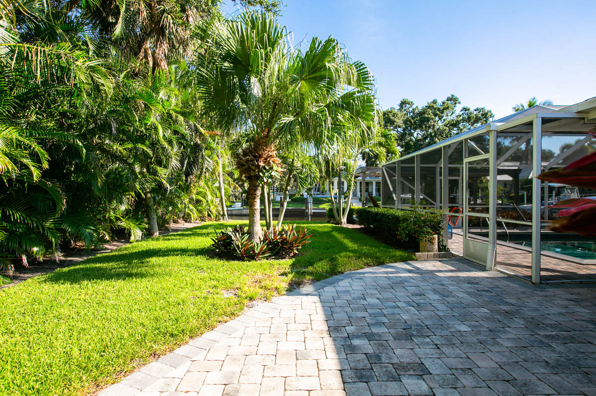 The fenced back yard and patio has a custom built fountain 