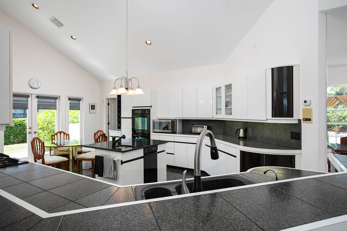 Kitchen with Center Island, Granite Counter & Sink 