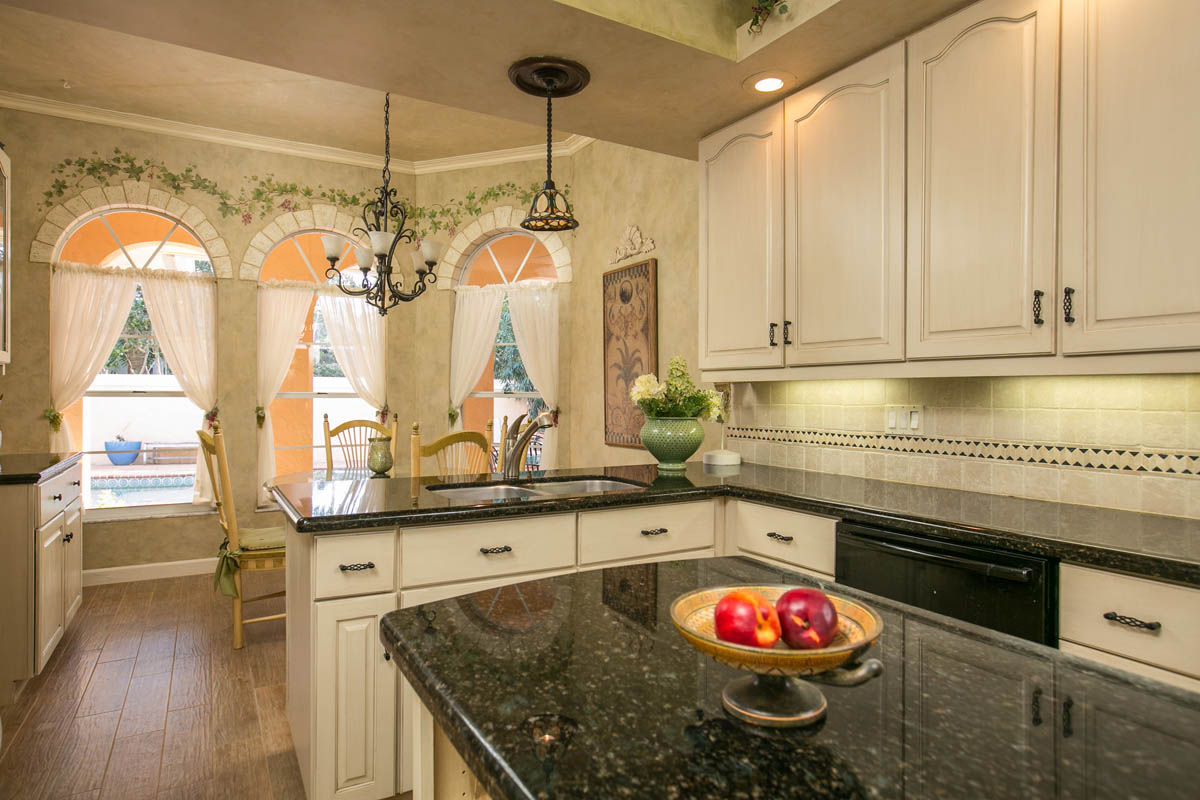 There are plenty of cabinets around the kitchen area along with a baker’s rack.     