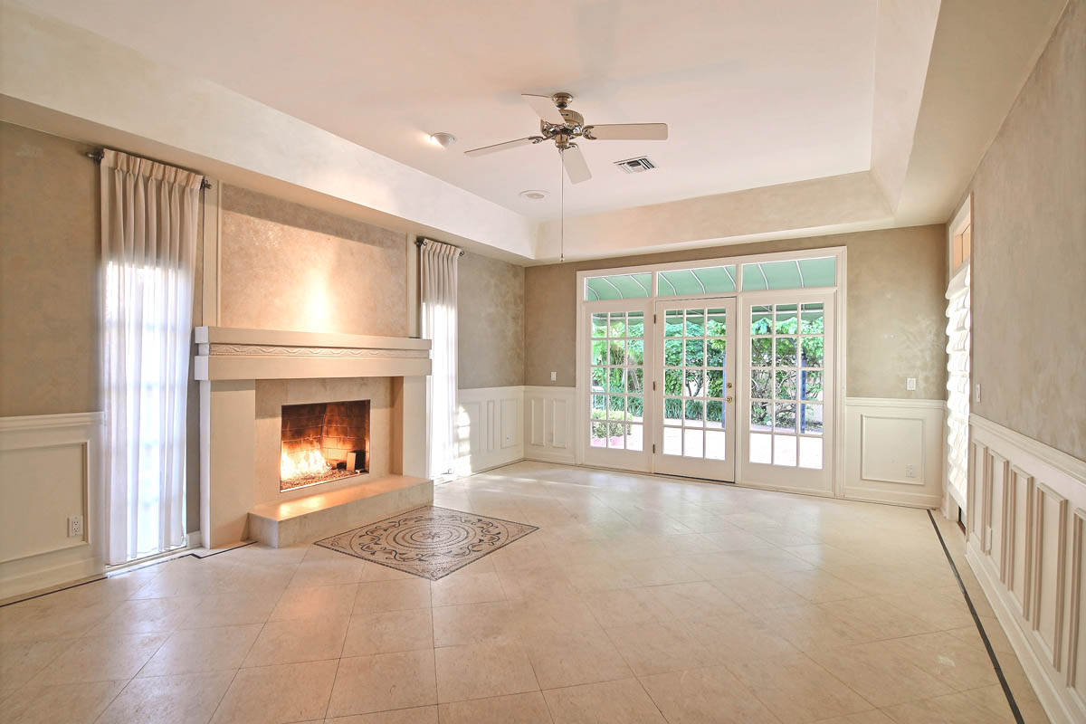 Master bedroom (unfurnished) with limestone floor, custom mosaic inlay as a focal point and panel molding.                  