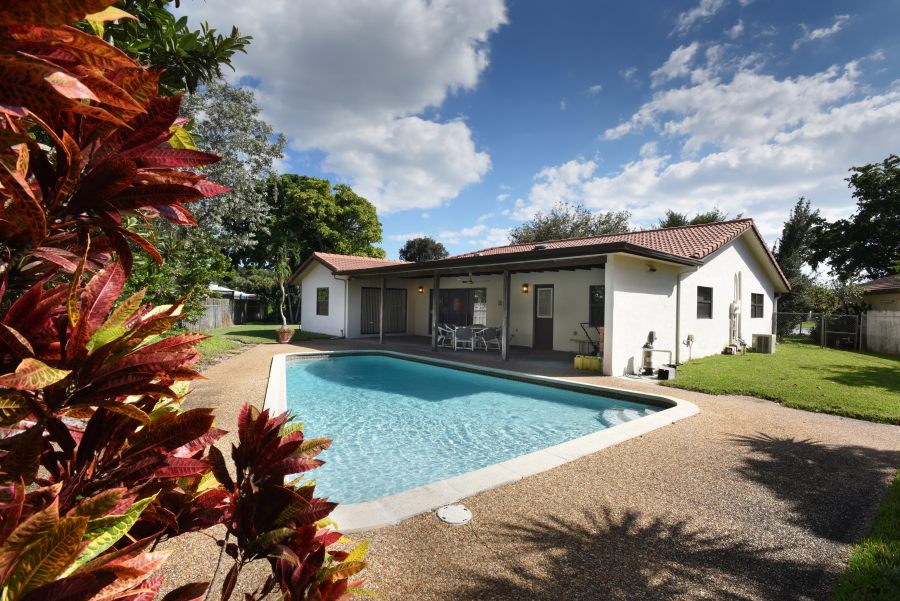 A nice backyard with the pool invites family and friends 