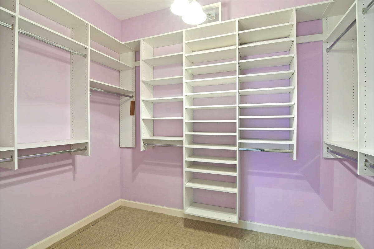 One of the 2 walk-in closets with built-in custom organizers.                  