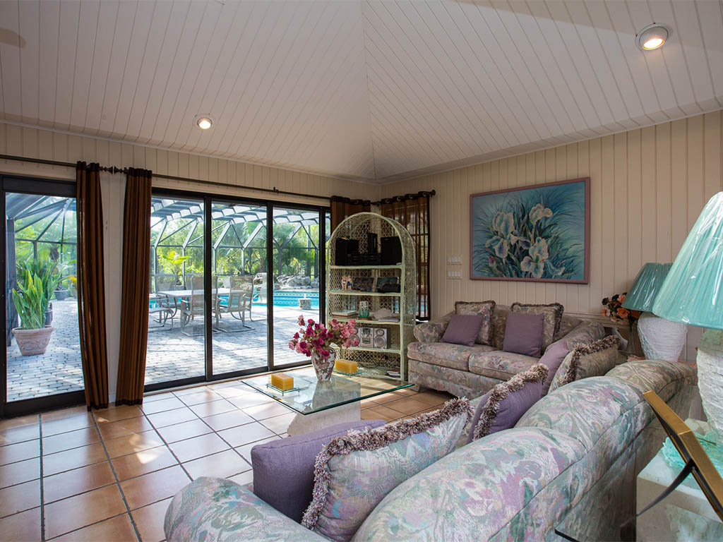 Another view of the Living/Great Room of the Country Estate that opens up into the covered Lanai and Pool area 