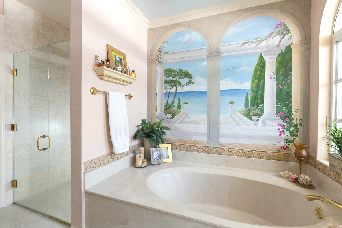 Master Bath with a Trompe L'oeil Mural with great water view on top of the tub makes you wanting to step outside.               