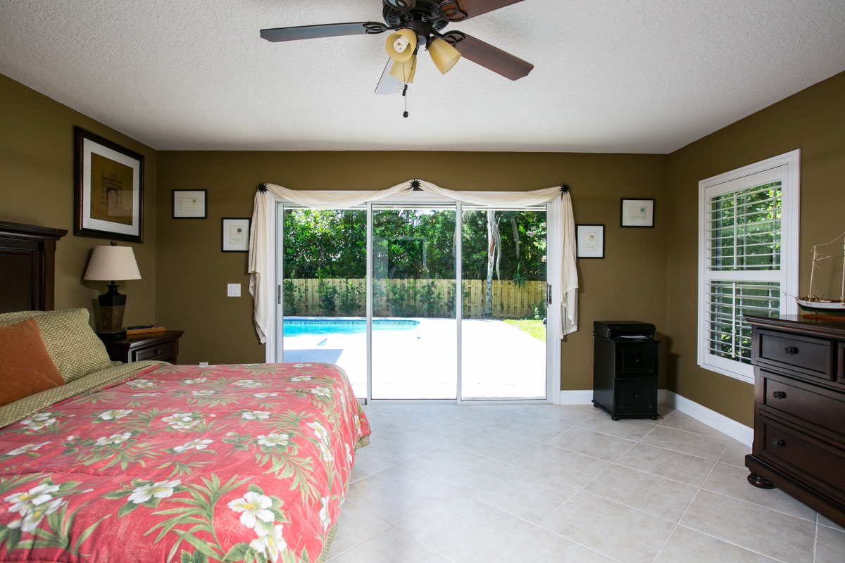 Master Bedroom with pool & garden views 