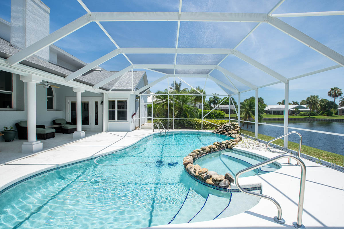 Screened Pool area overlooking the Lake & Cabana Bath