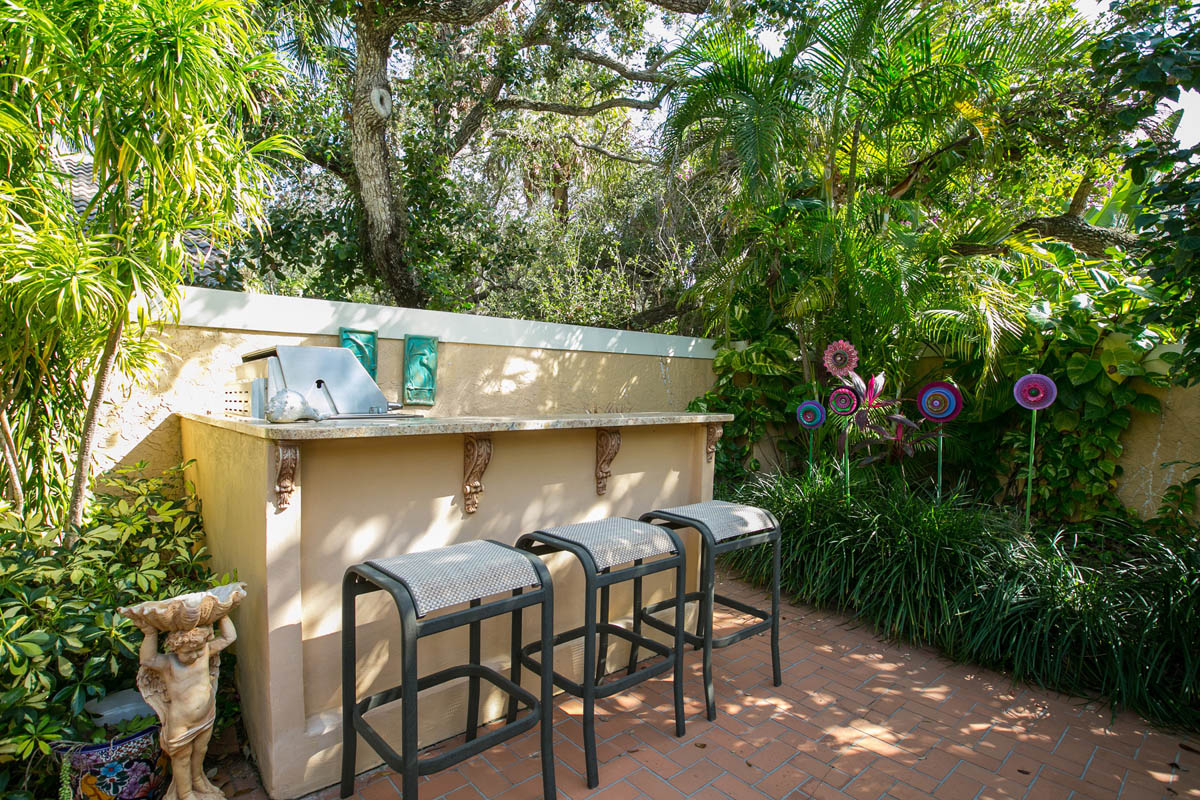 The barbeque area with granite bar top and artistic accents.            