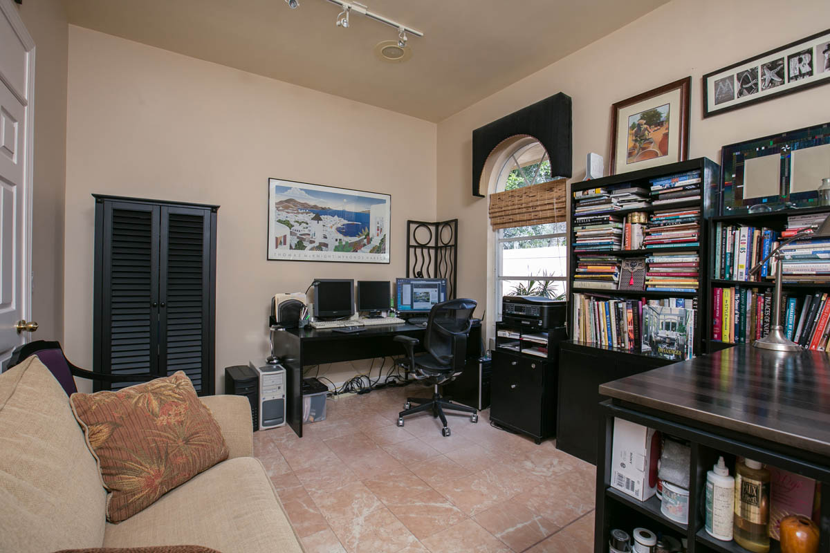 This large 4th bedroom that can be used as an office has marble tile floors and garden views.  