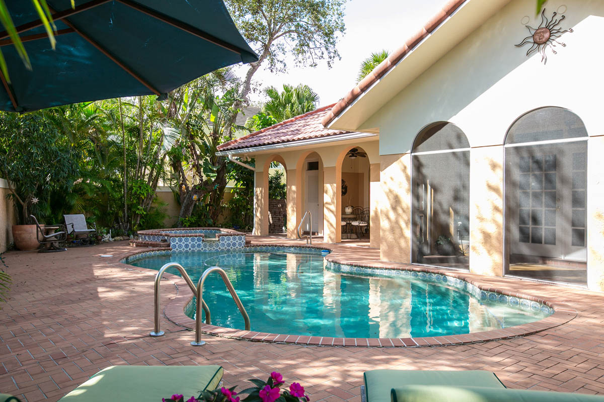 A westward view of pool patio extenuates the inviting outdoor space.            