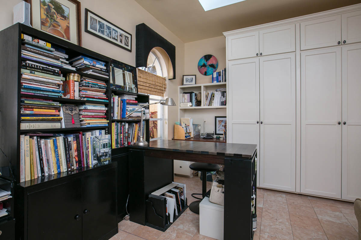 The 4th bedroom or office features custom closets and a built-in desk.  