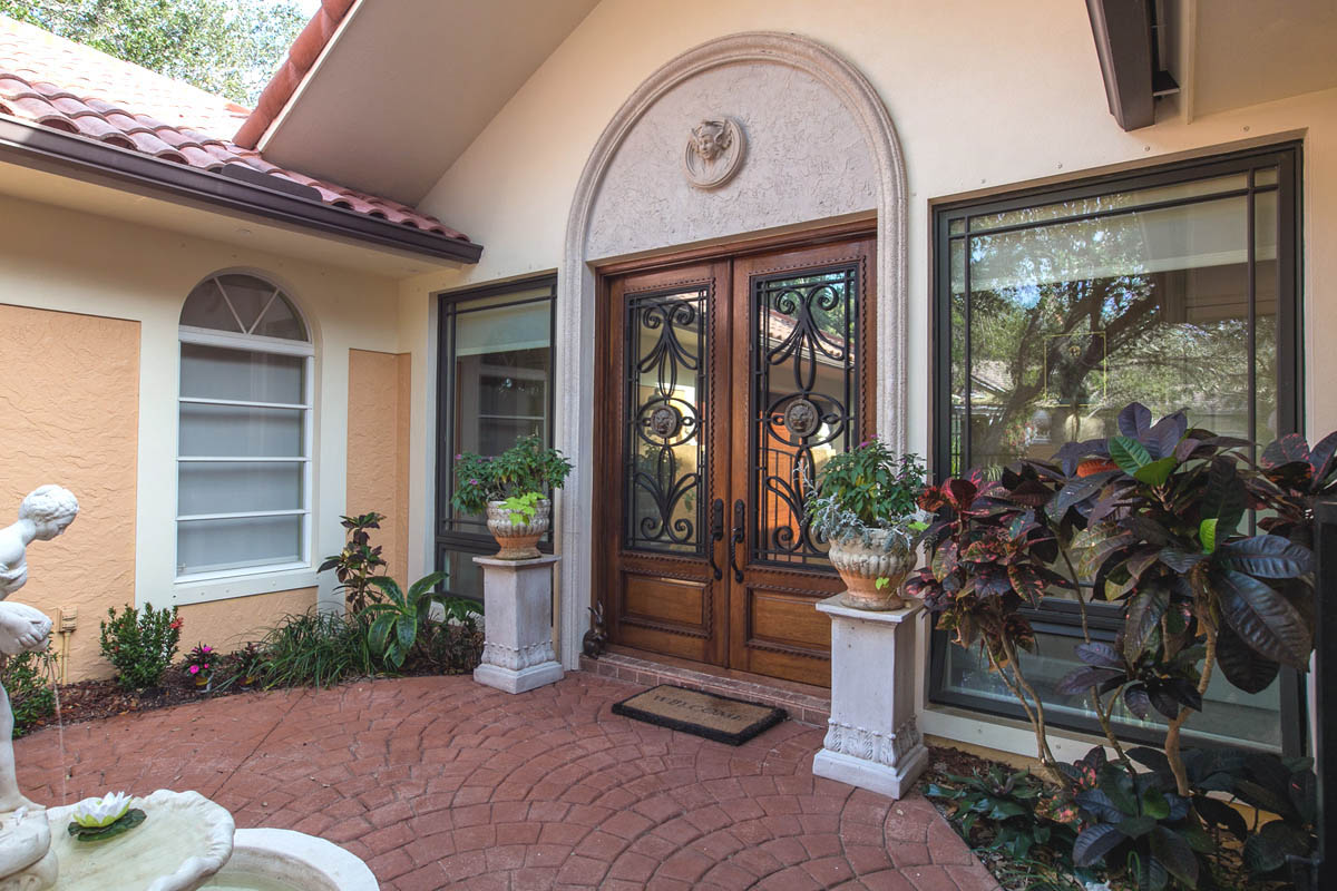 Entryway with fountain and custom designed door and archway.                     