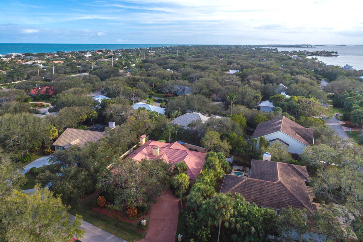 An aerial view of the house looking south in this ocean to river community with ocean intracoastal views.           