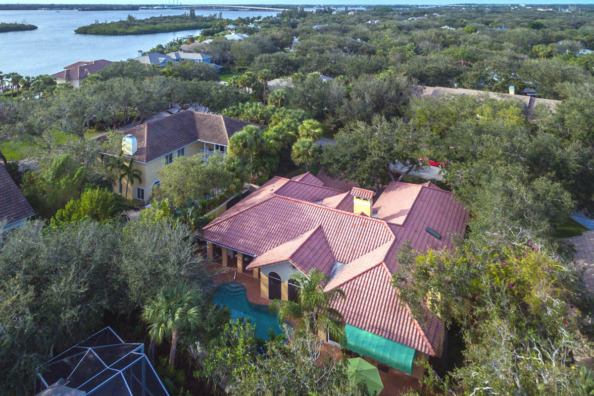 An aerial view of the house showing the back yard and Indian River.              