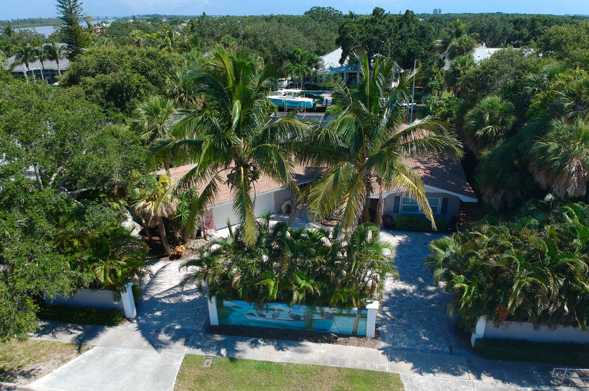 Aerial view of the exterior front of this waterfront home in Vero Beach