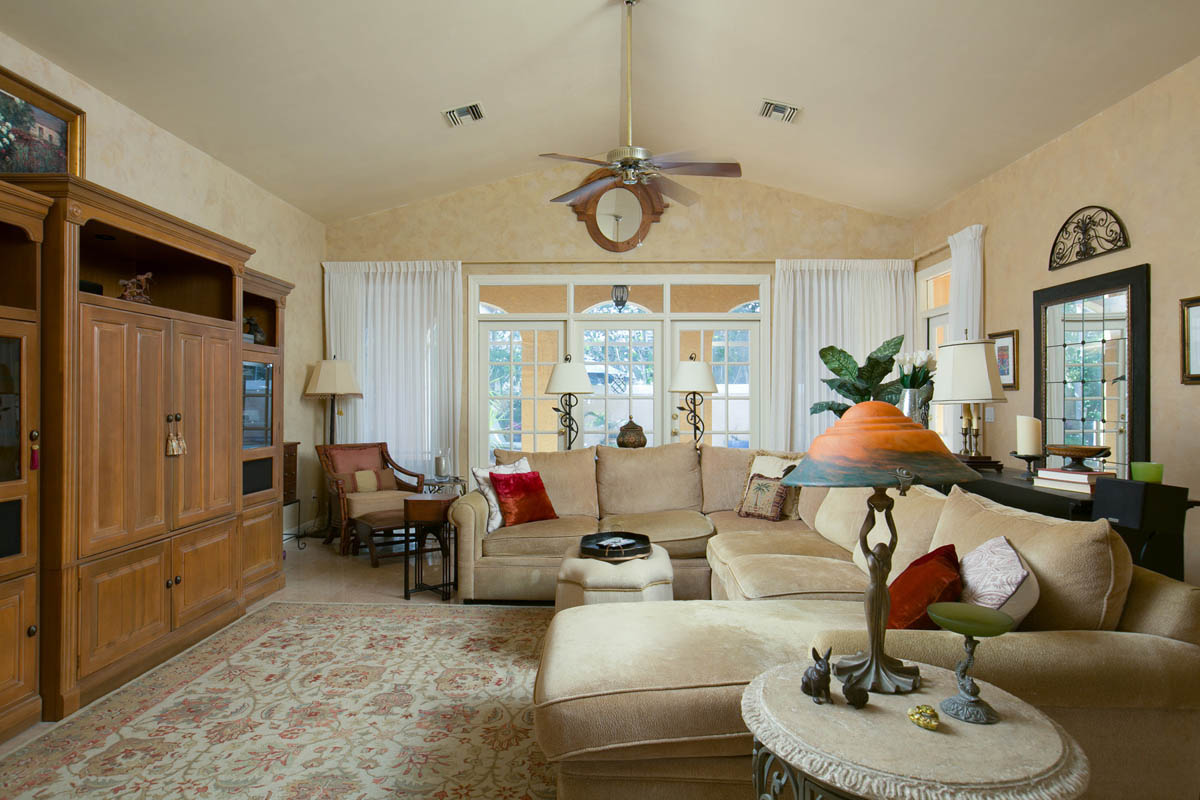 Great Room with French Doors to the screened porch and pool patio area.                 
