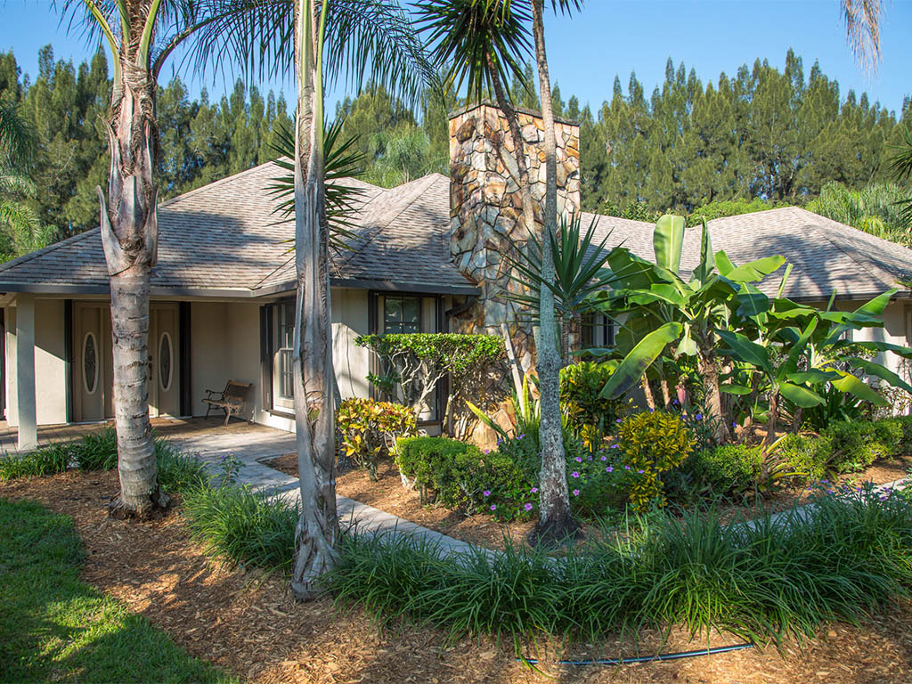 Another view of the front of the main house of this Country Estate in Vero Beach