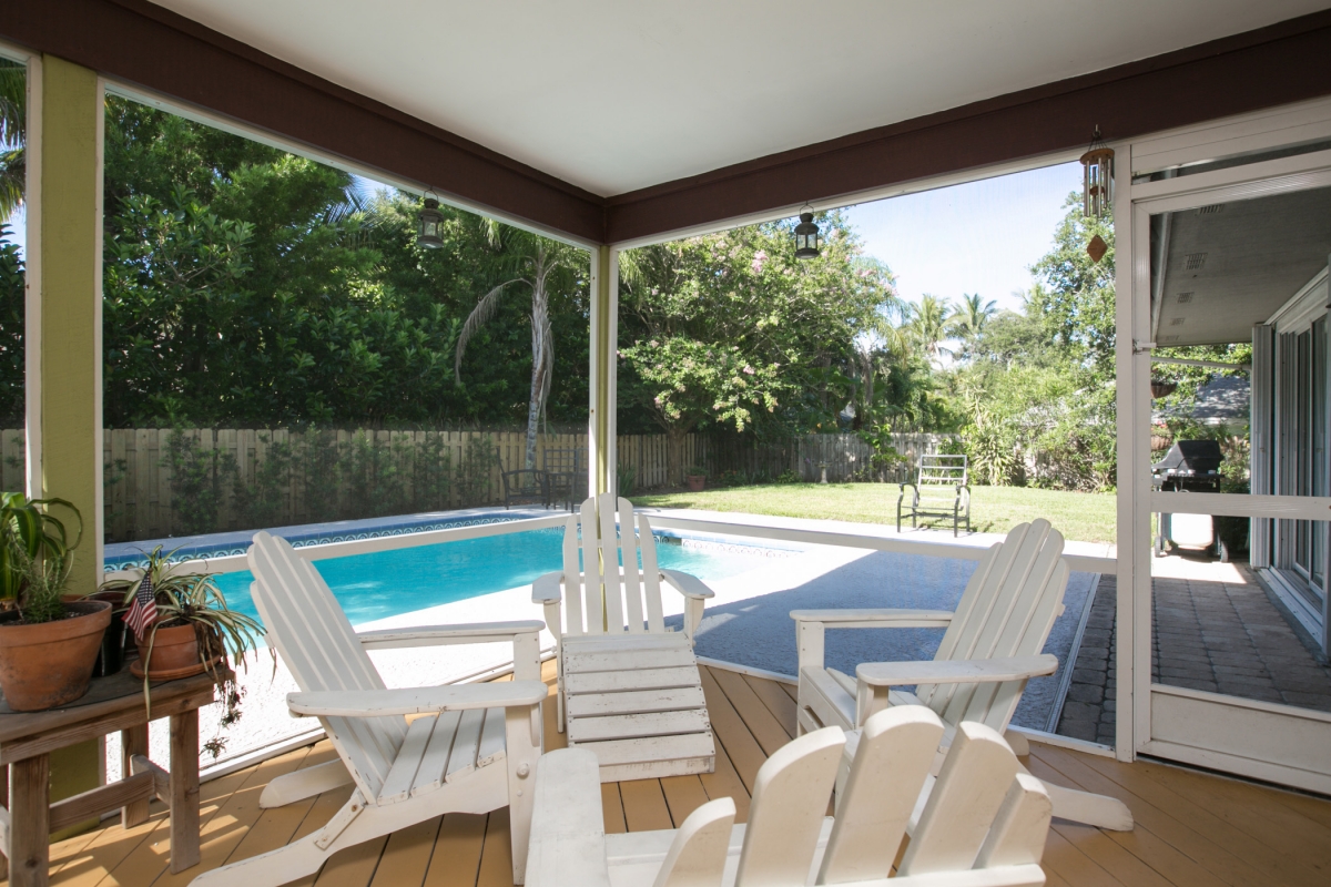 Entertain your guests in the screened enclosed lanai with pool and garden views