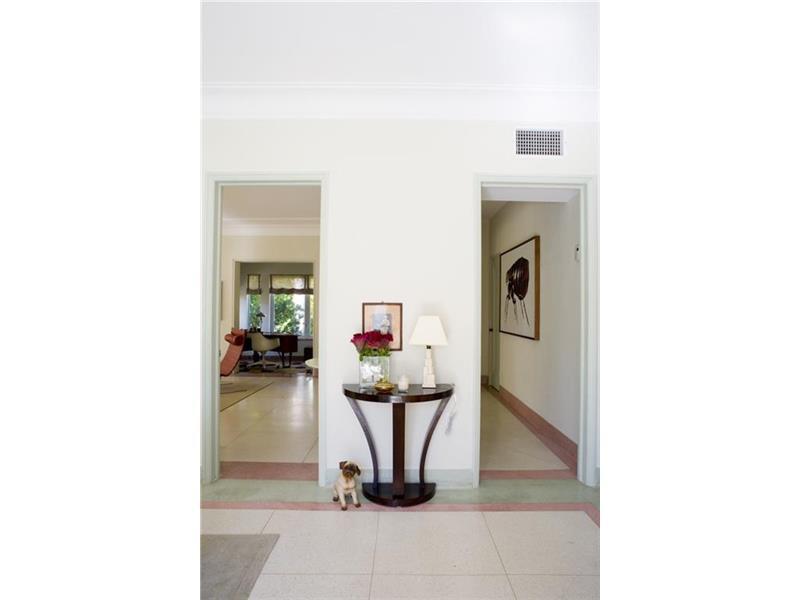 The Living Room with the original Terrazzo floors brings you back to the Art Deco era in old Miami Beach.