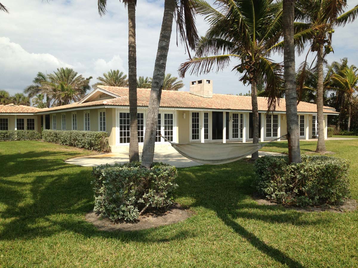 The floor-to-ceiling impact resistant French doors t span the whole back of the main house and offer unobstructed ocean views.   