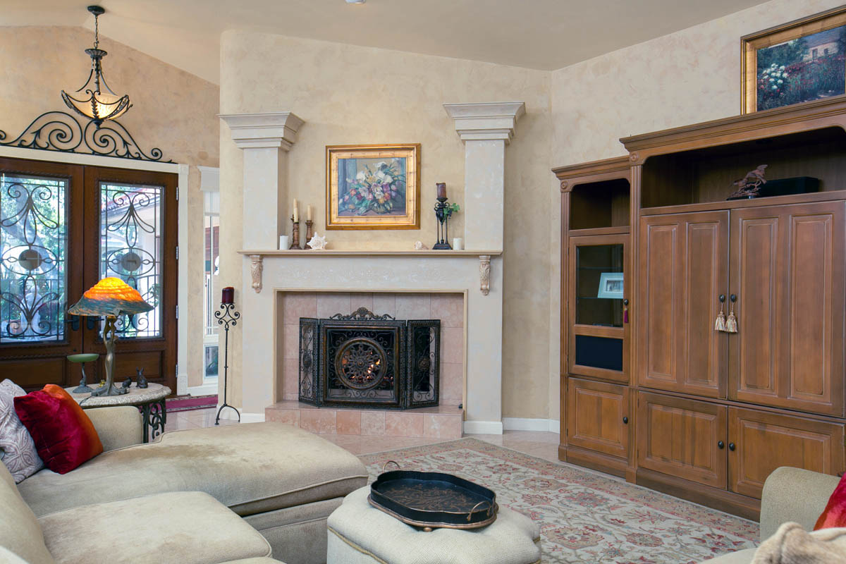 Living room with fireplace custom designed and painted mantel.                      