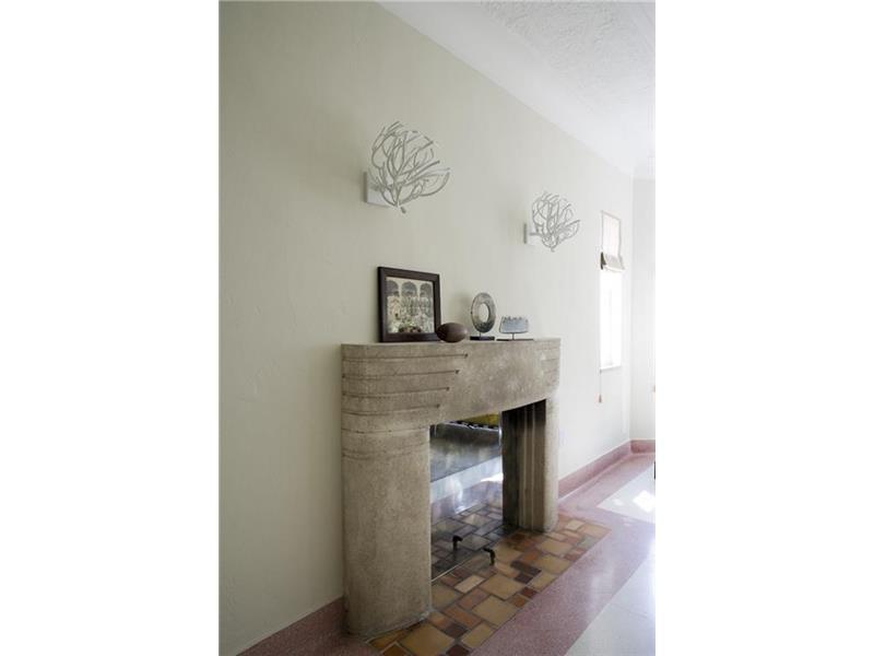 The Decorative Fireplace is another authentic element reminiscent of the Art Deco movement.