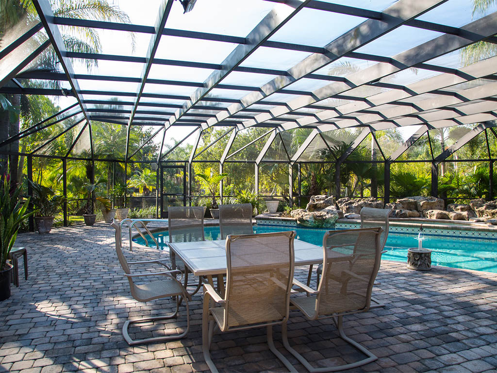 Enter the covered Lanai and Pool area from the Great Room 